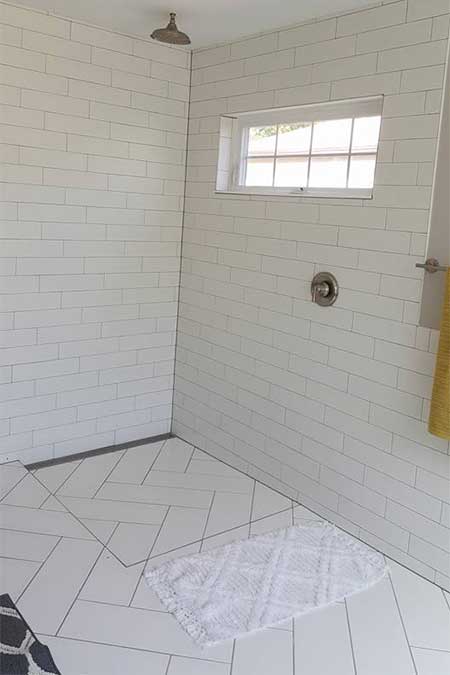 A bathroom with crossing tiles