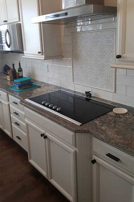 A kitchen with a granite counter